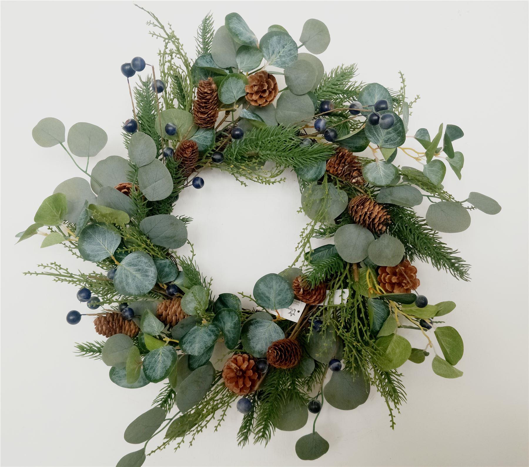 Natural Looking Wreath Decorated With Black Berries And Leaves