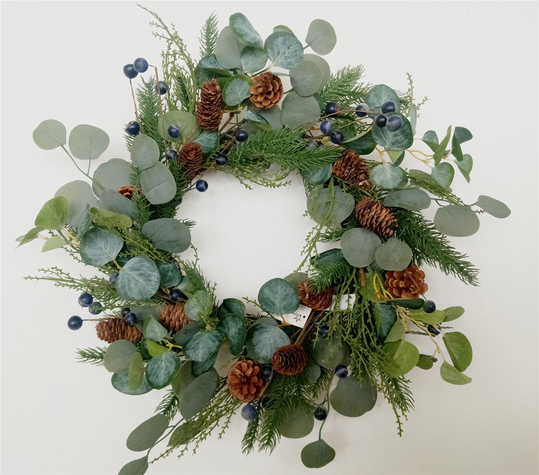 Natural Looking Wreath Decorated With Black Berries And Leaves